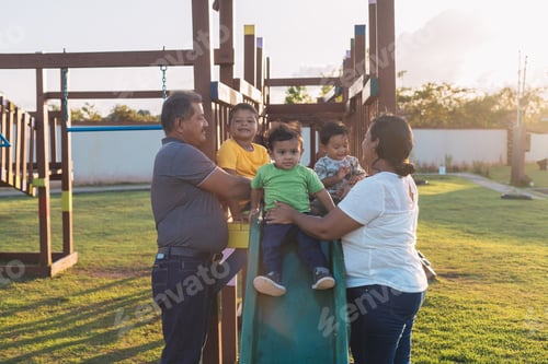 Preview: grandparents playing are their grandchildren in the park