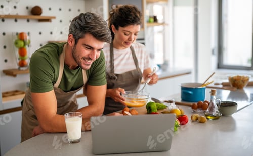 Preview: Secret ingredient is love. Couple preparing a healthy meal together while spending free time at home
