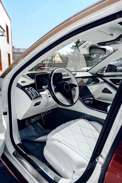 Preview: Modern luxury car interior with advanced technology and white leather details