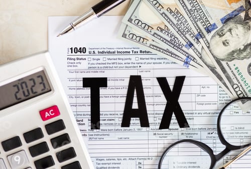 Preview: Individual income tax return form for tax payment on working desk. Calculation tax return in 2023