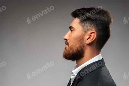 Preview: Portrait of handsome confident business on gray background