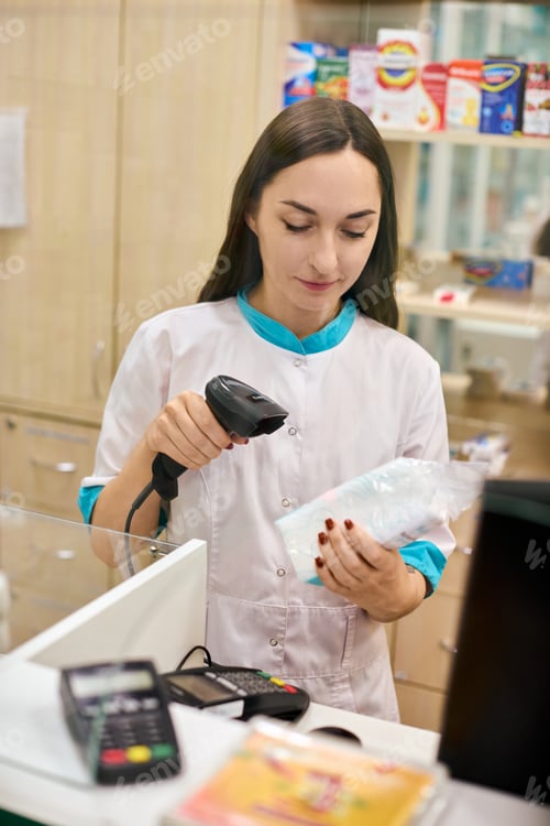 Preview: Pharmacist scans barcode in pharmacy setting