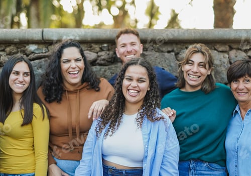 Preview: Group of multi generational people having fun together outdoor while smiling in front of camera