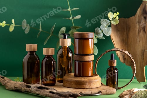 Preview: Glass brown containers for cosmetics with wooden lids. Cream, dropper bottle and lotion. Green