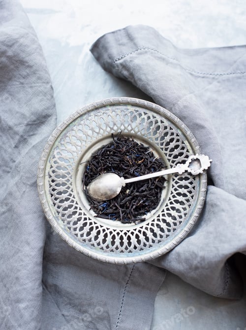 Preview: Fresh tea leaves in silver plate