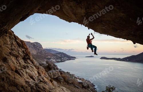 Preview: Rock climber hanging on rope after falling of cliff