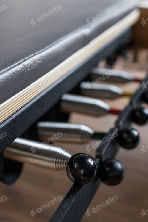 Preview: Pilates equipment. Springs close up. Reformer bed. Reformer pilates studio machine for fitness