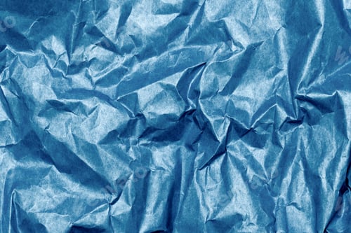 Preview: Crumpled blue paper textured background