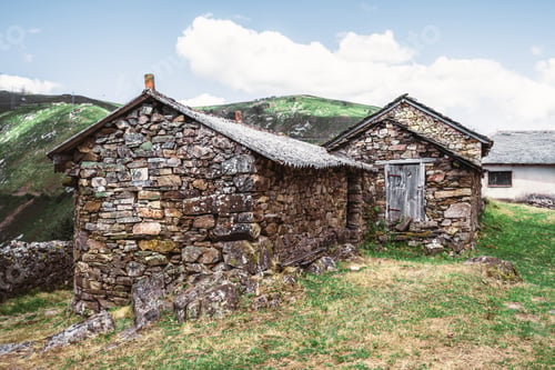 Preview: Rustic stone huts in mountain meadow