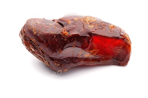 Preview: Natural amber. A piece of yellow opaque natural amber on white background