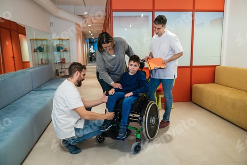 Preview: Boy with mother receiving medical orthopedic care