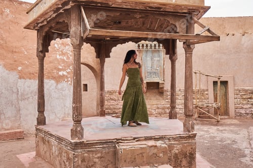 Preview: Woman dancing on street stage between ancient buildings