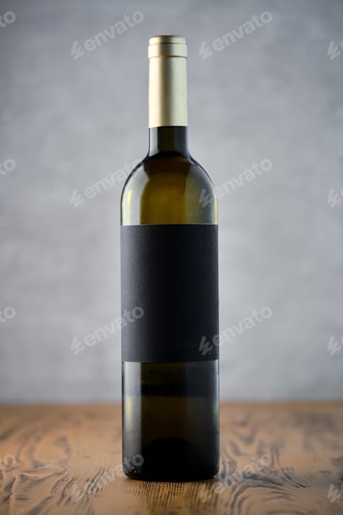 Preview: Single Wine Bottle with Blank Label on Wooden Surface