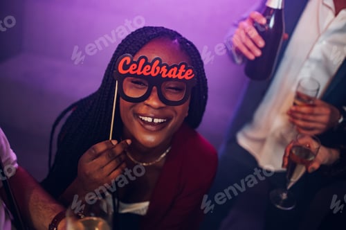 Preview: Happy group of friends dancing on a party in a club while drinking champagne