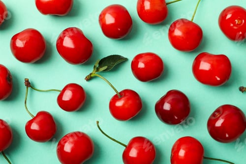 Preview: Flat lay with red cherry on mint background, close up