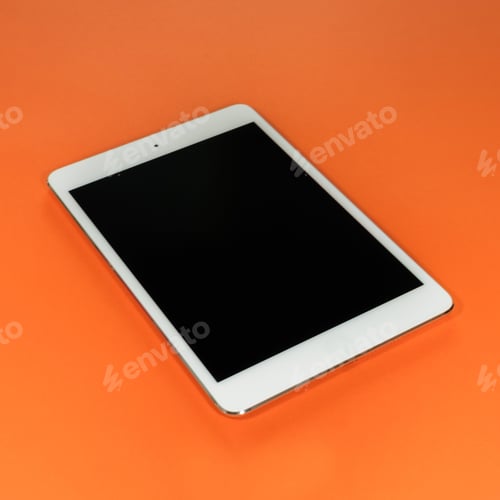 Preview: Single white tablet on an orange background