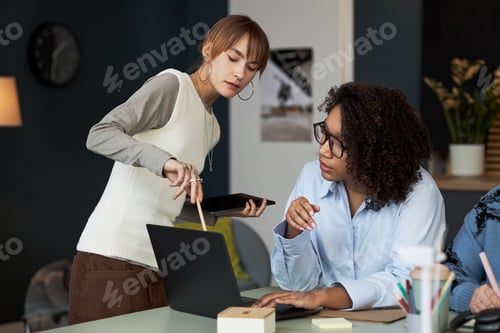 Preview: Colleagues Discussing Online Project Together