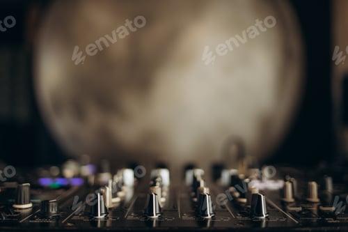 Preview: Close-Up of Audio Mixer with Abstract Background Emphasizing Creativity