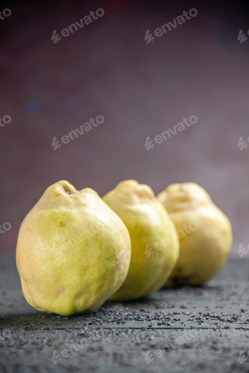 Preview: front view fresh quinces mellow and sour fruits on dark desk ripe fetus fresh tree sour taste plant