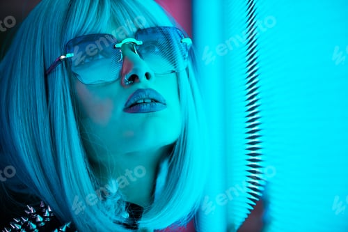 Preview: Beautiful woman illuminated by led lights