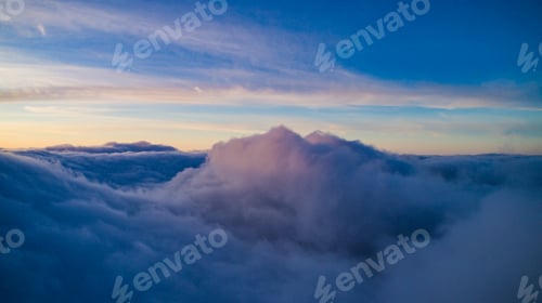 Preview: Magical view of cumulus clouds in winter at sunset