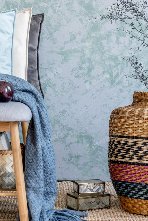 Preview: Stylish composition of cozy living room interior details and colorful classy pillows.