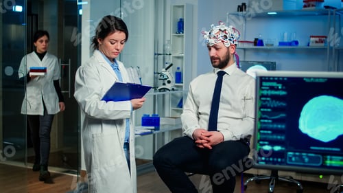 Preview: Medical doctor and man patient talking about symptoms of disease