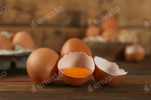Preview: Raw brown chicken eggs on wooden table