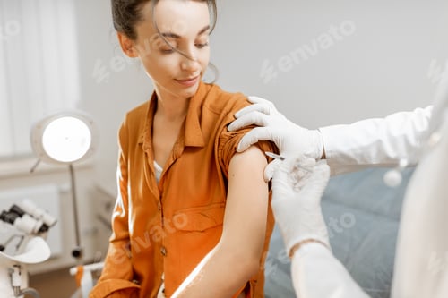 Woman Receives Vaccine Shot in Doctor's Office