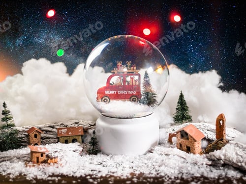 Preview: Christmas ball and small decorative houses nearby