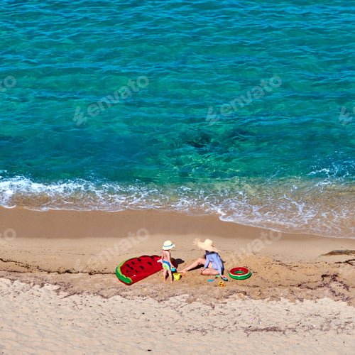 Preview: Two Year Old Toddler Boy And His Mother On Beach With Inflatable Float And Ring. Summer Family