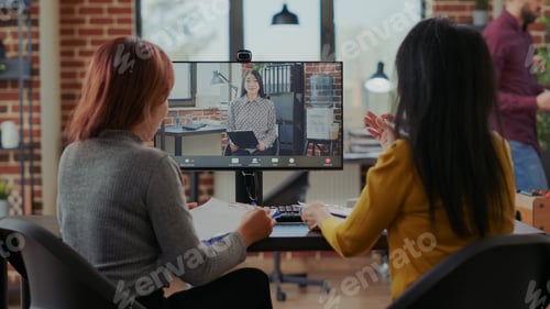 Preview: Asian women interviewing candidate to fill job vacancy on video call