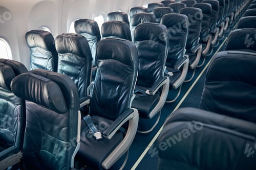 Preview: Interior of economy coach seats inside of passenger airplane