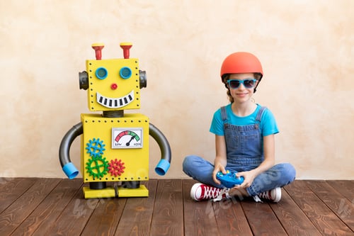 Preview: Happy child with toy robot