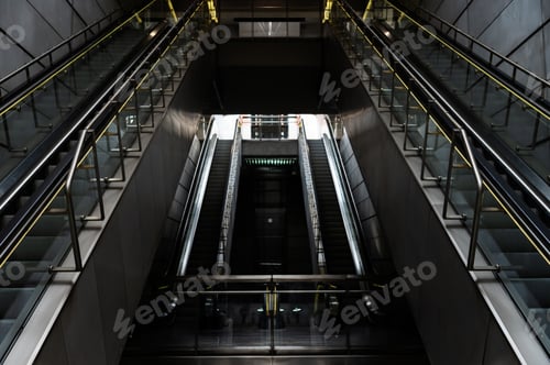 Preview: The entrance to the subway station features steel escalators and.