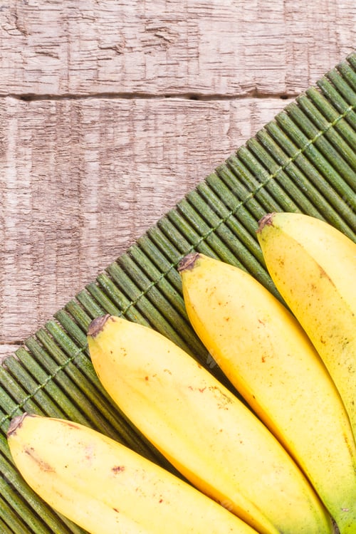 Preview: banana fruit on the wooden table (Musa × paradisiaca)