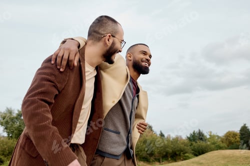 Preview: Stylish male models enjoying a crisp autumn day while posing in a vibrant natural setting