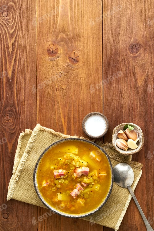 Preview: Winter hot soup with chopped green peas, pork, bacon, smoked on dark