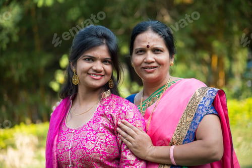 Preview: Portrait of happy mother and daughter embracing.