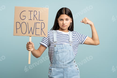 Preview: Teen Holds Girl Power Sign and Flexes Arm