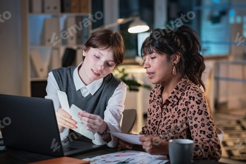 Preview: Colleagues working in team at office