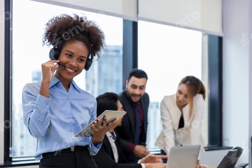 Preview: Call center business woman talking on headset.