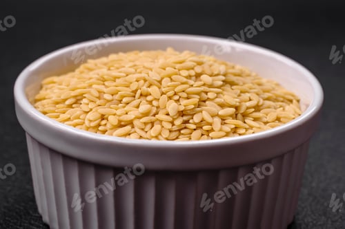 Preview: Raw whole grain orzo pasta as an ingredient for a delicious dish