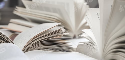 Preview: stack of books, close up. Open book on the table in library. Back to school concept.