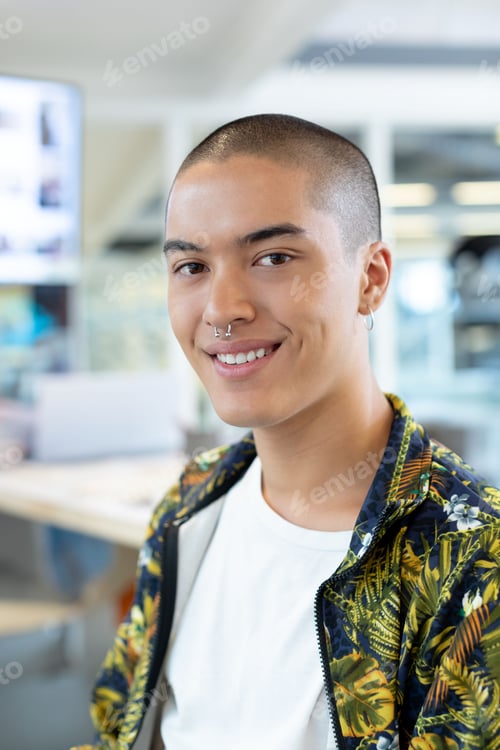 Preview: Man wearing botanical print jacket working at office desk with desktop monitor and glass partition
