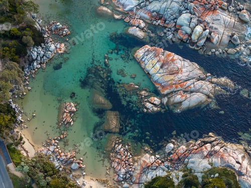 Preview: Aerial shot of a beautiful coast with turquoise waters and rocks