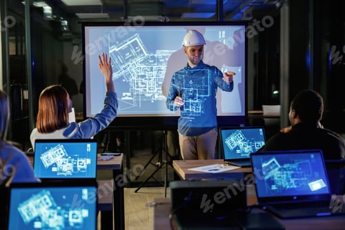 Preview: Male architect is showing construction site project on blue projector for people