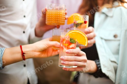 Preview: Crop couple drinking cocktails together