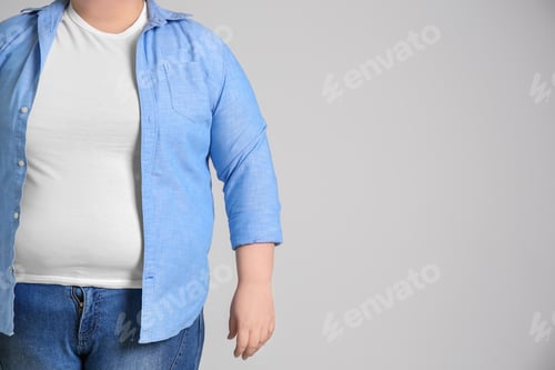 Preview: Overweight woman on light background