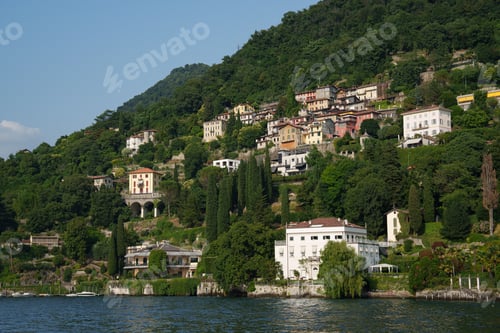 Preview: Villas on the shores of Lake Como, Italy - Summer landscape with hills and architecture.